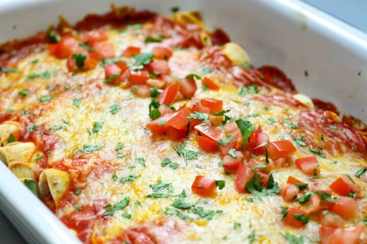 A casserole dish of enchiladas after baking. 