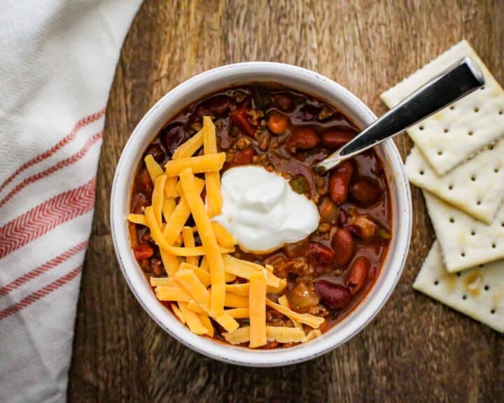 Chili topped with sour cream and cheese