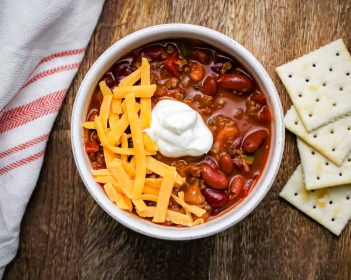 Chili topped with sour cream and cheese
