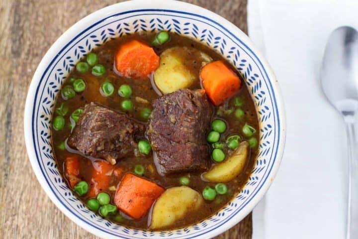 Overhead view of a bowl of beef stew.