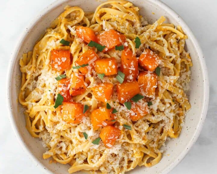 Roasted butternut squash pasta served in a bowl. 