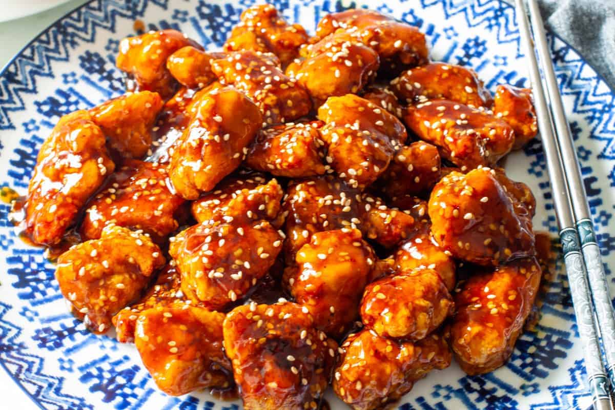 sesame chicken served on a large platter.