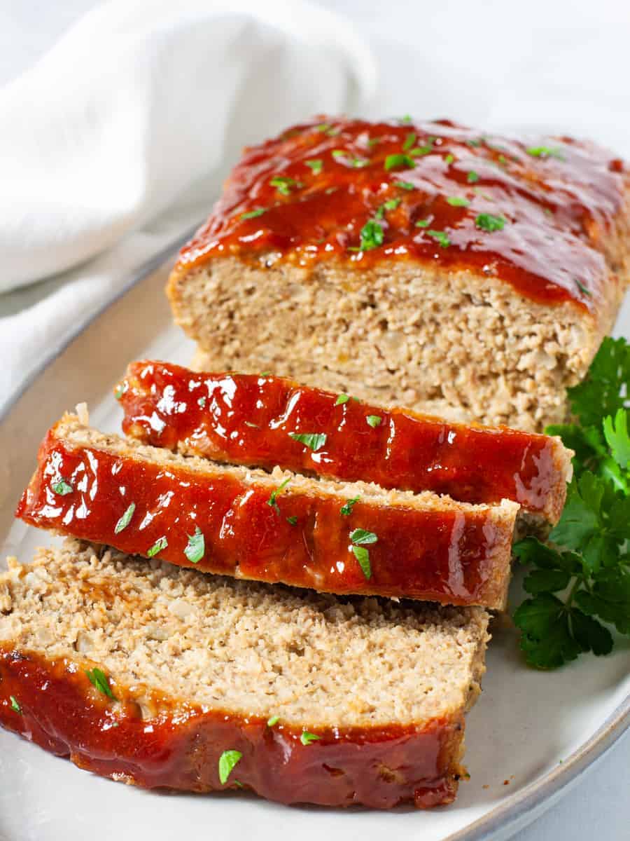 Sliced turkey meatloaf on platter.