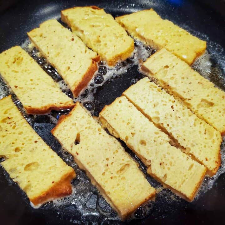 pan frying the bread strips in butter