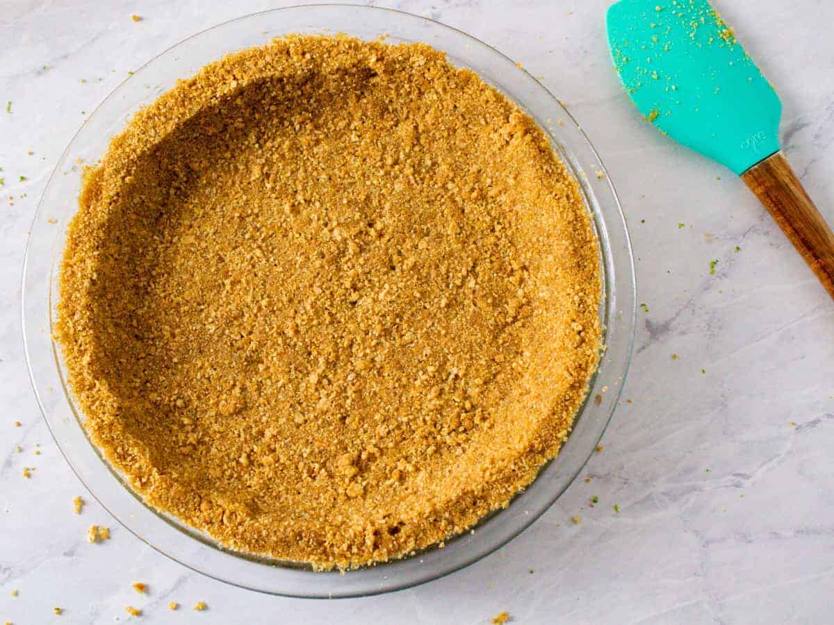 Crust mixture shown formed into a glass pie dish and ready for baking.