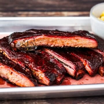 Smoked spare ribs on a platter.