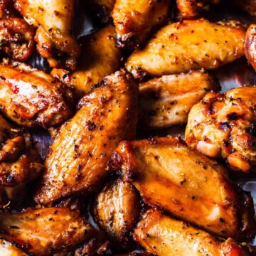 Close up overhead image of a platter of smoked chicken wings