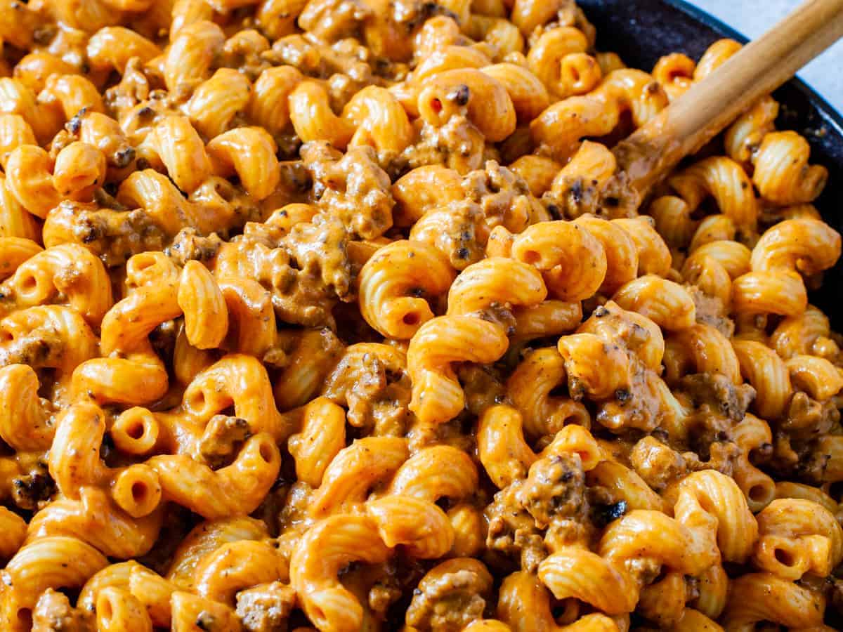 Close up shot of the finished cheesy pasta with ground beef.