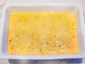 The casserole is shown with all ingredients in the dish, before being baked.