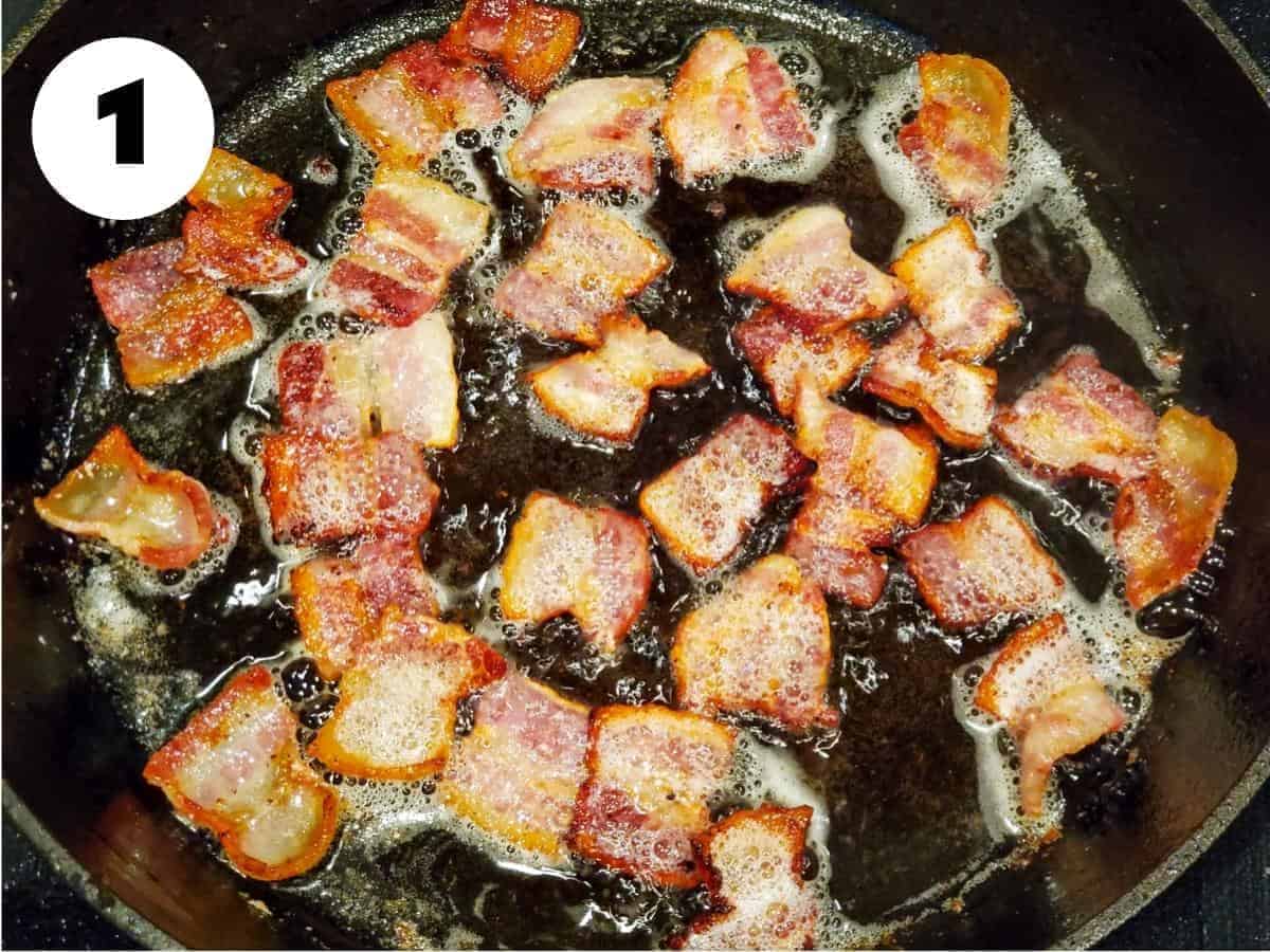 Bacon cooking in a cast iron skillet.