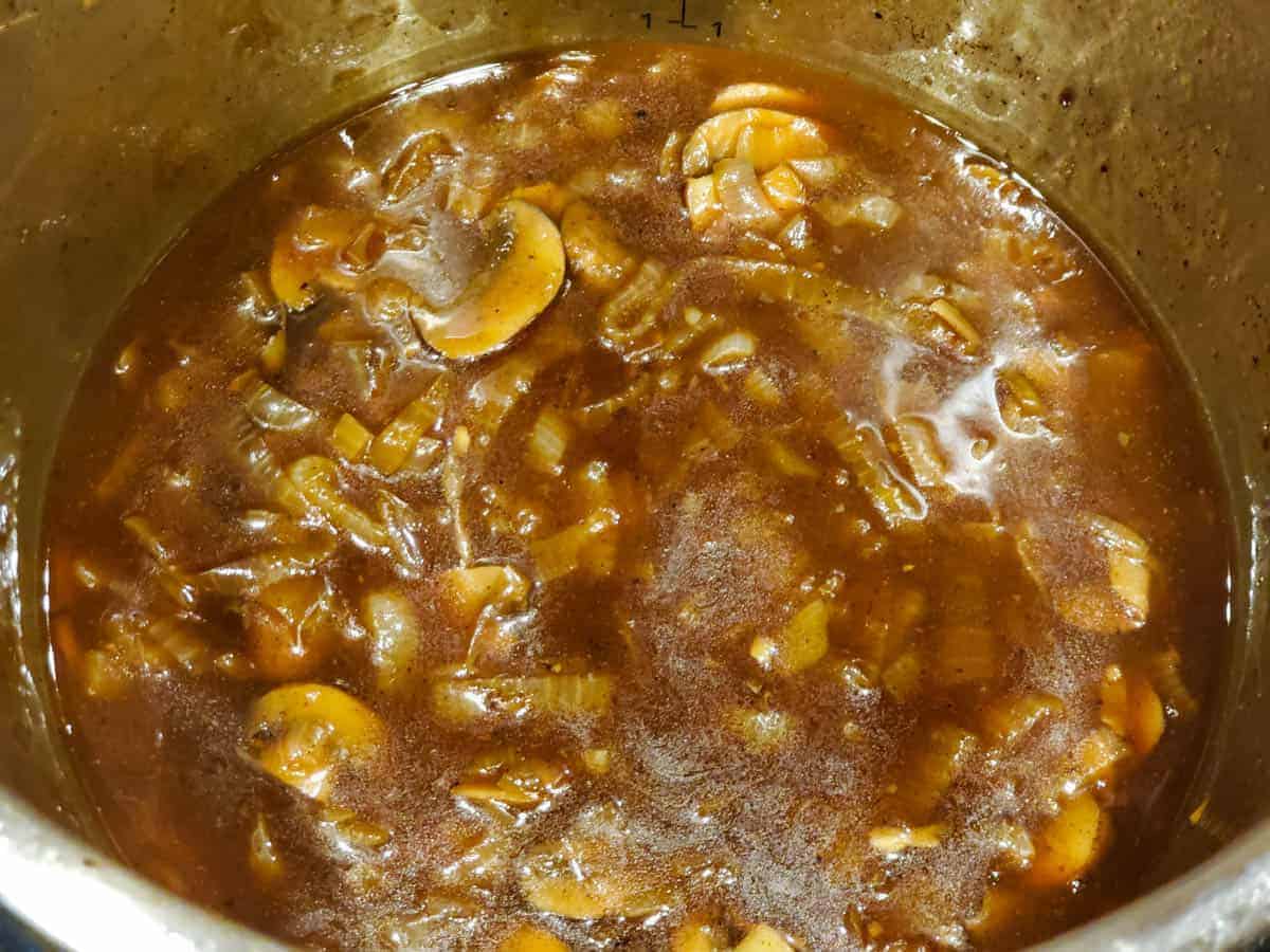 Mushroom and onion gravy being prepared in an Instant Pot.