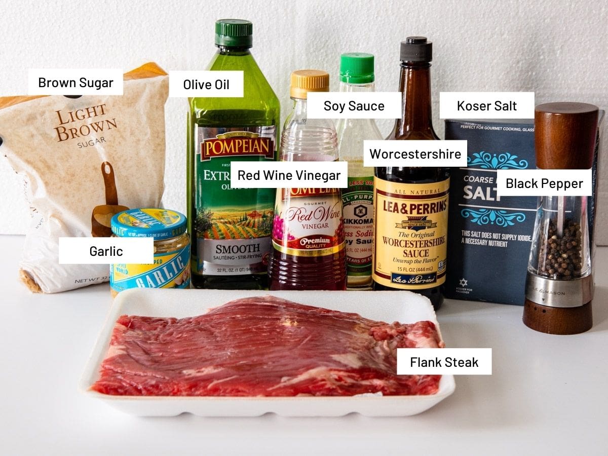 Ingredients for grilled flank steak shown on a counter. 