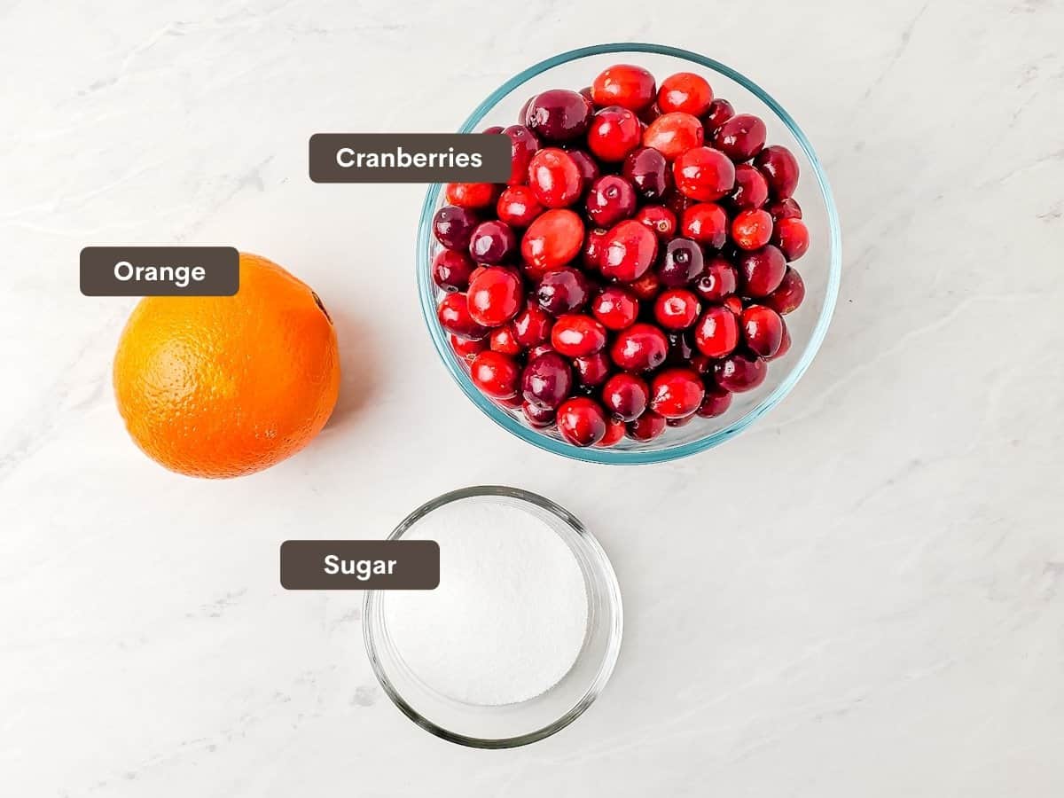 Ingredients for cranberry sauce arranged on a counter.