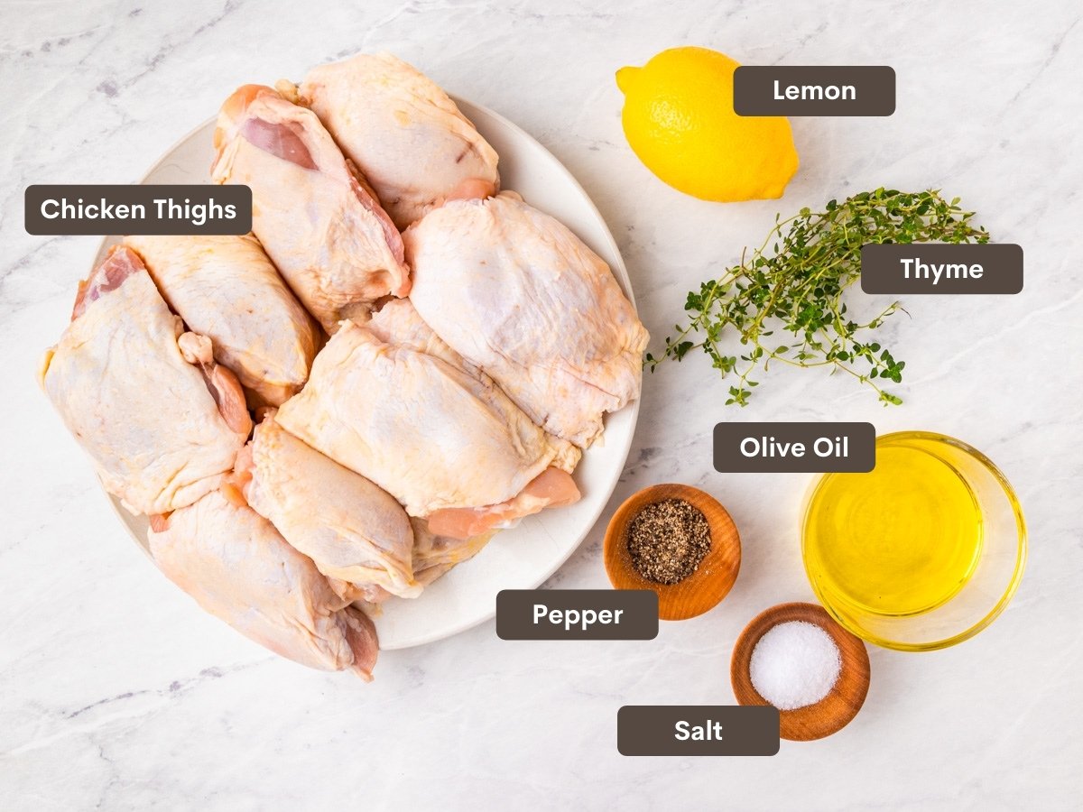 The ingredients for the chicken thighs are shown arranged on a counter.