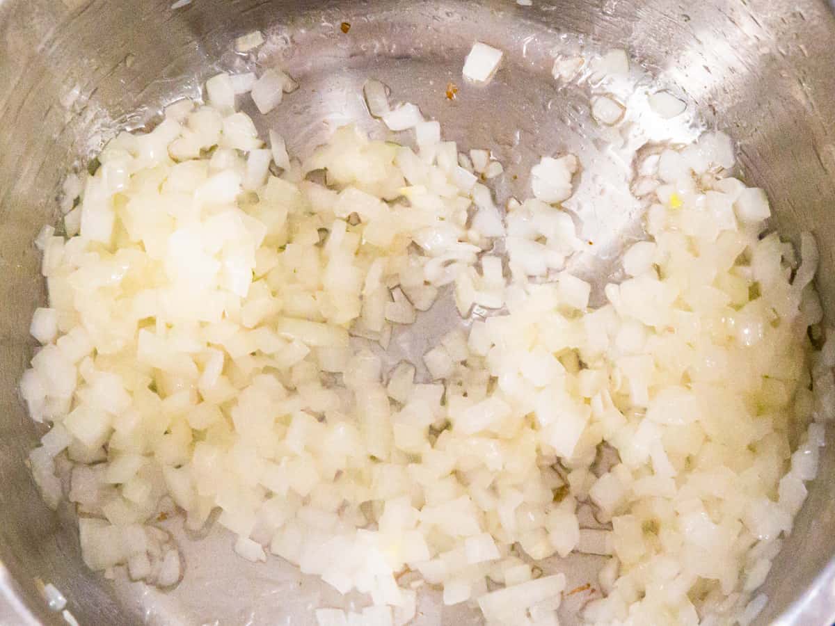 Diced onions being cooked in an Instant Pot.