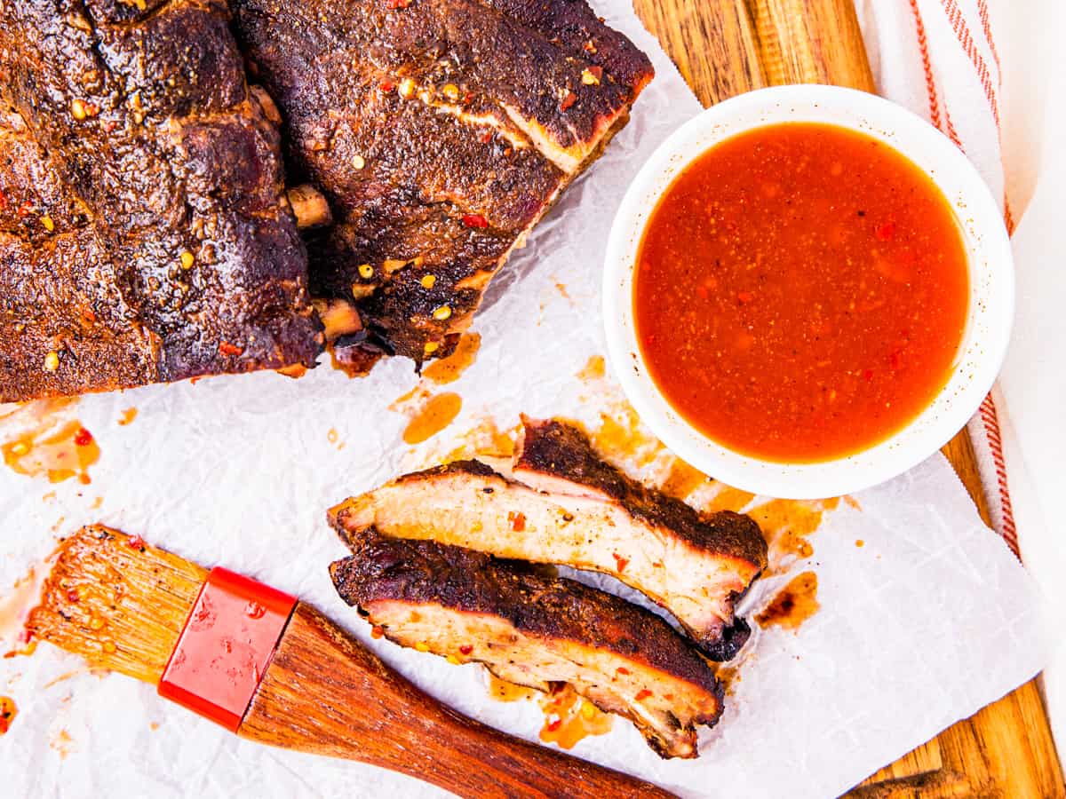 Smoked ribs coated with North Carolina barbecue sauce.