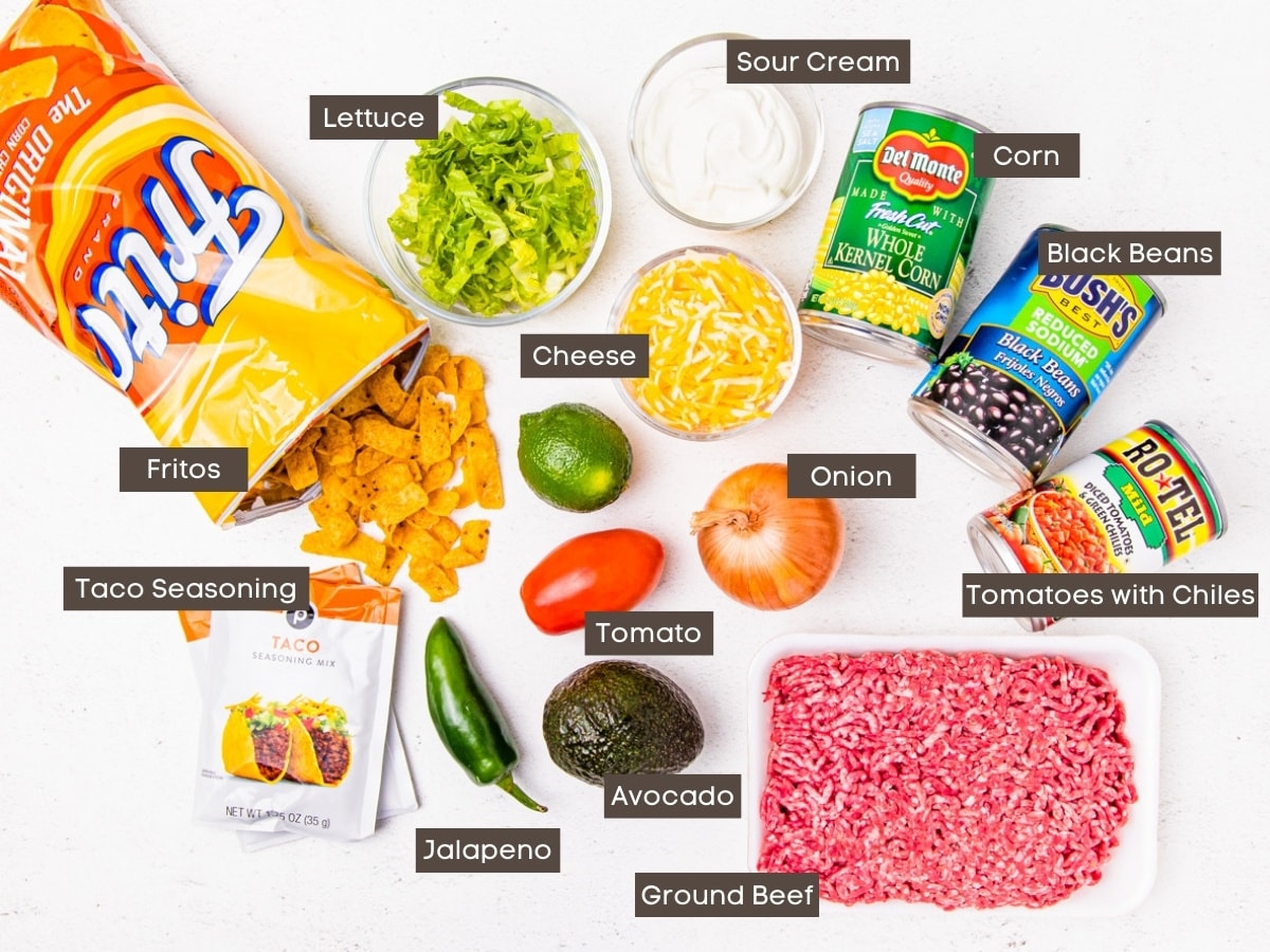 The ingredients for Walking Taco Casserole are shown arranged on a countertop. 