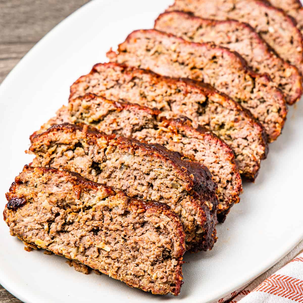 Sliced meatloaf shown served on a platter.