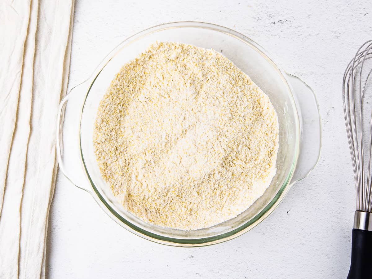 Dry ingredients for cornbread shown in a mixing bowl.