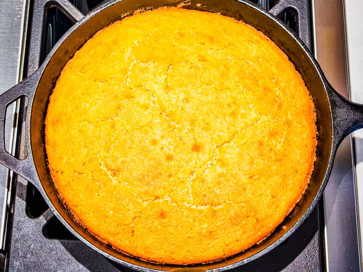 Cooked cornbread in a cast iron skillet. 