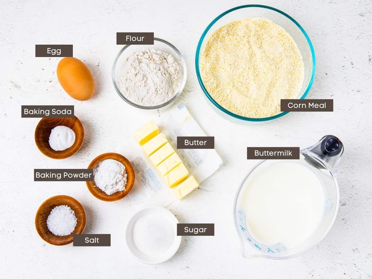 Ingredients for cornbread shown arranged on a countertop with labels added.