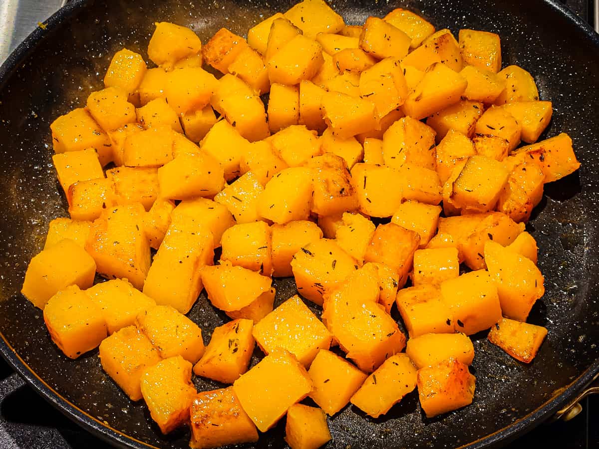 Butternut squash after being sauteed in a skillet. 