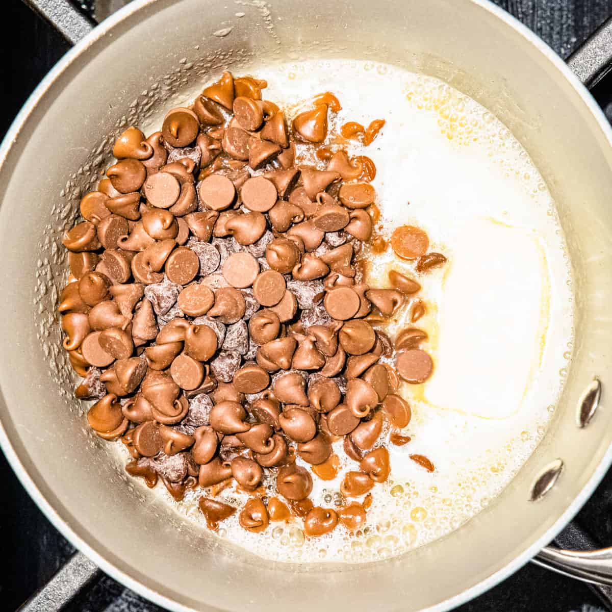 Chocolate and butter being melted in a pot.