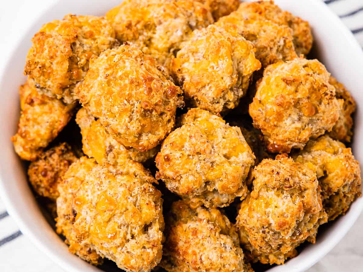 Close up of a serving bowl filled with sausage balls.