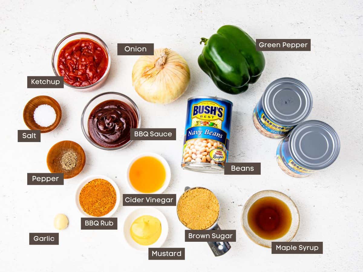 Ingredients for smoked baked beans shown arranged on a countertop. 