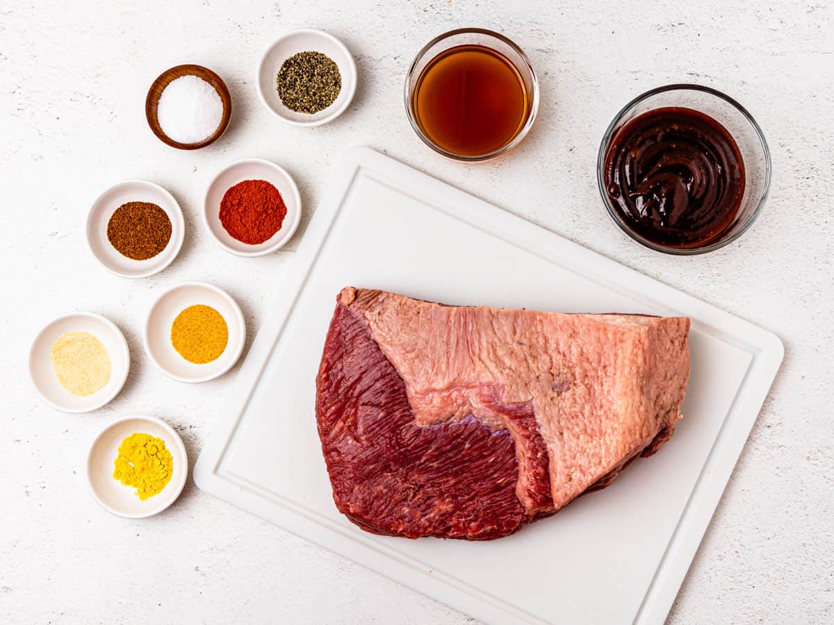 Ingredients for Instant Pot brisket shown arrange on a countertop in individual bowls. 