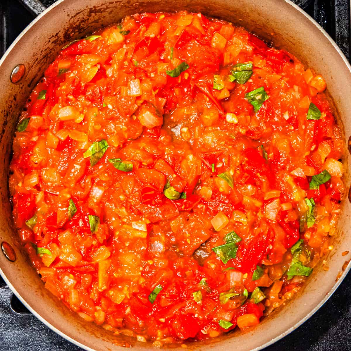 Pomodoro sauce cooking in a skillet.