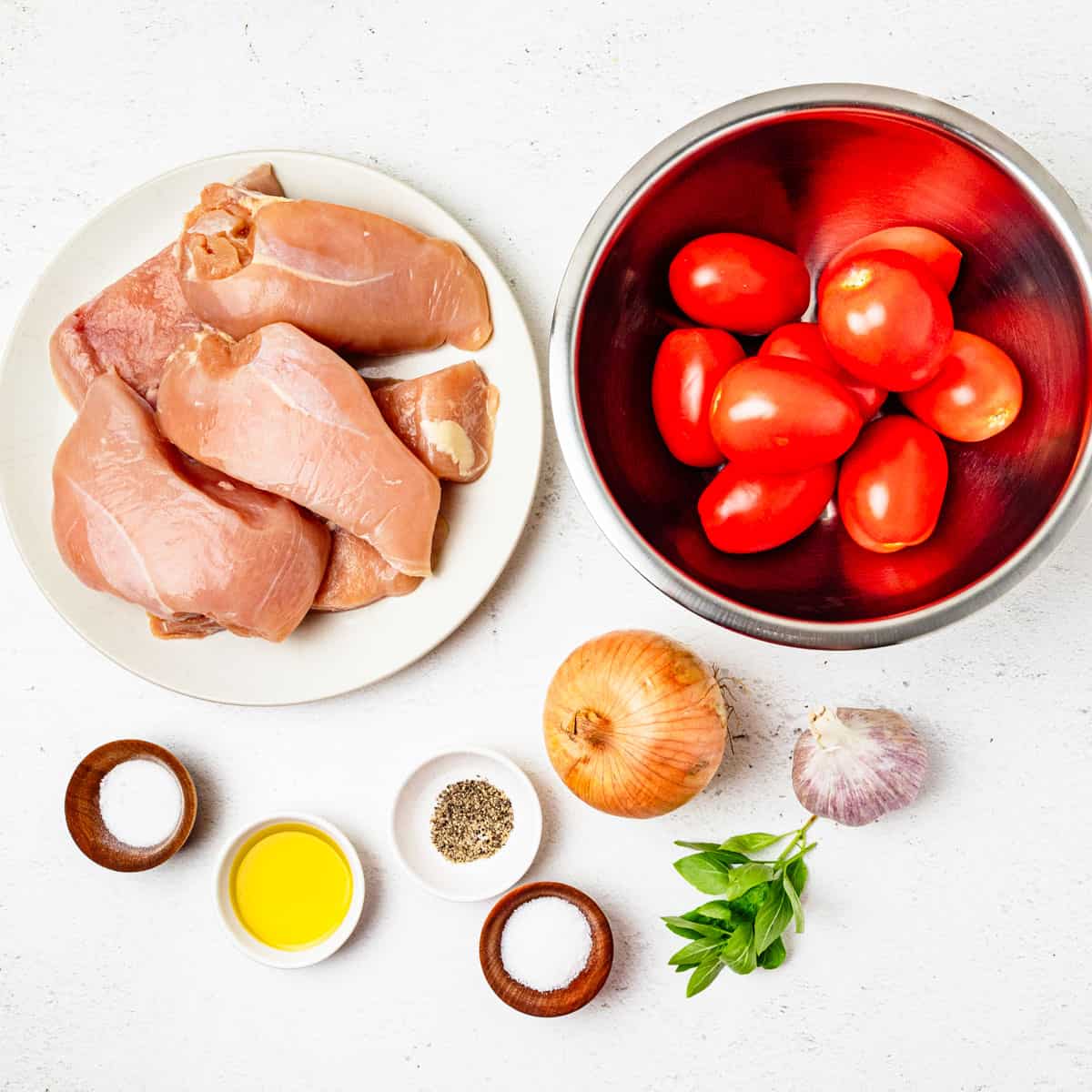 Ingredients for Chicken Pomodoro arranged on a countertop.