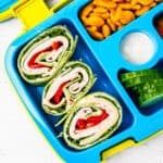 Turkey and cheese roll-ups in a lunchbox.