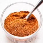 A small bowl of Creole seasoning.
