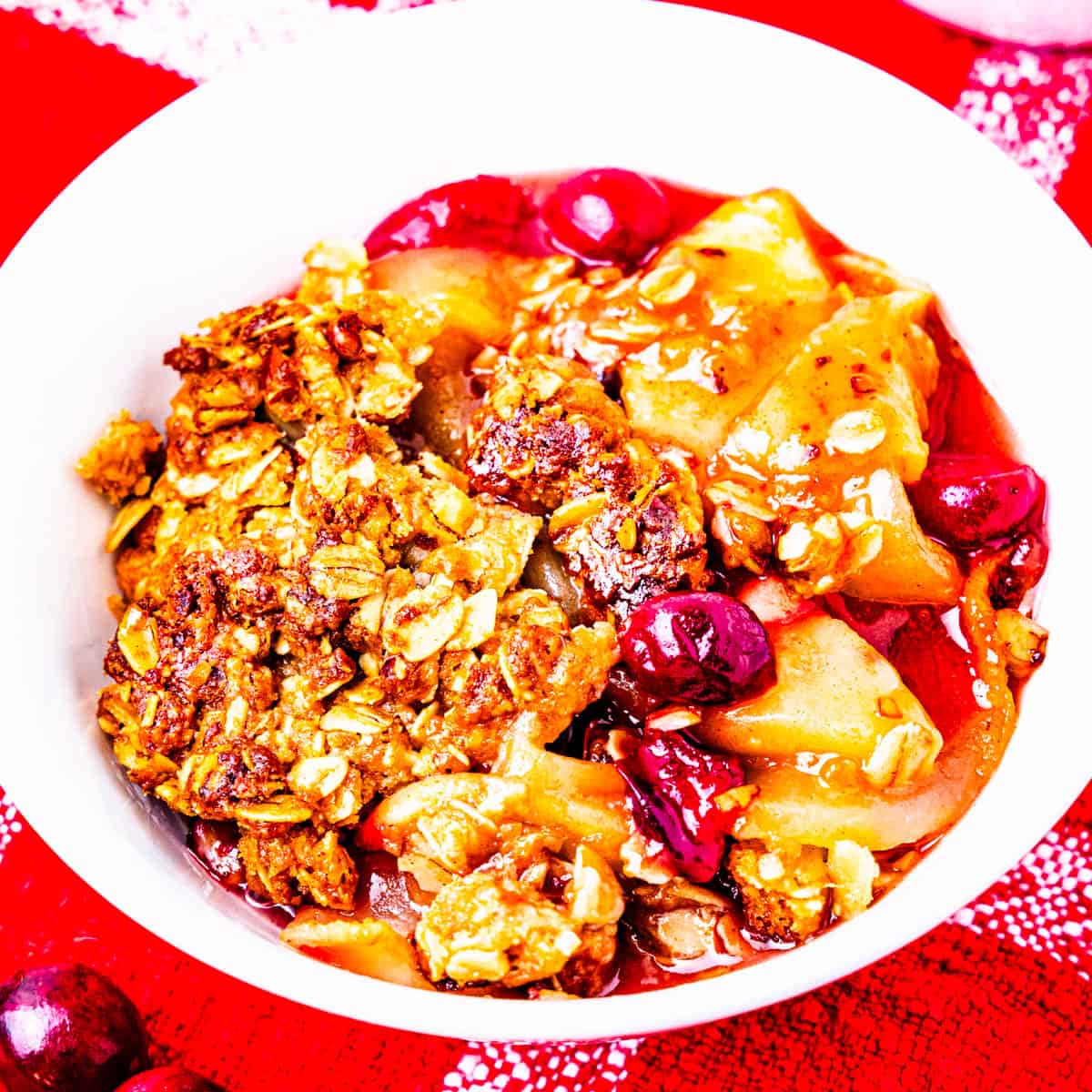 A small bowl of cranberry apple crisp.