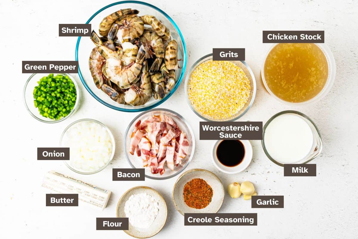 Ingredients for Cajun Shrimp and Grits arranged on a countertop in individual bowls.