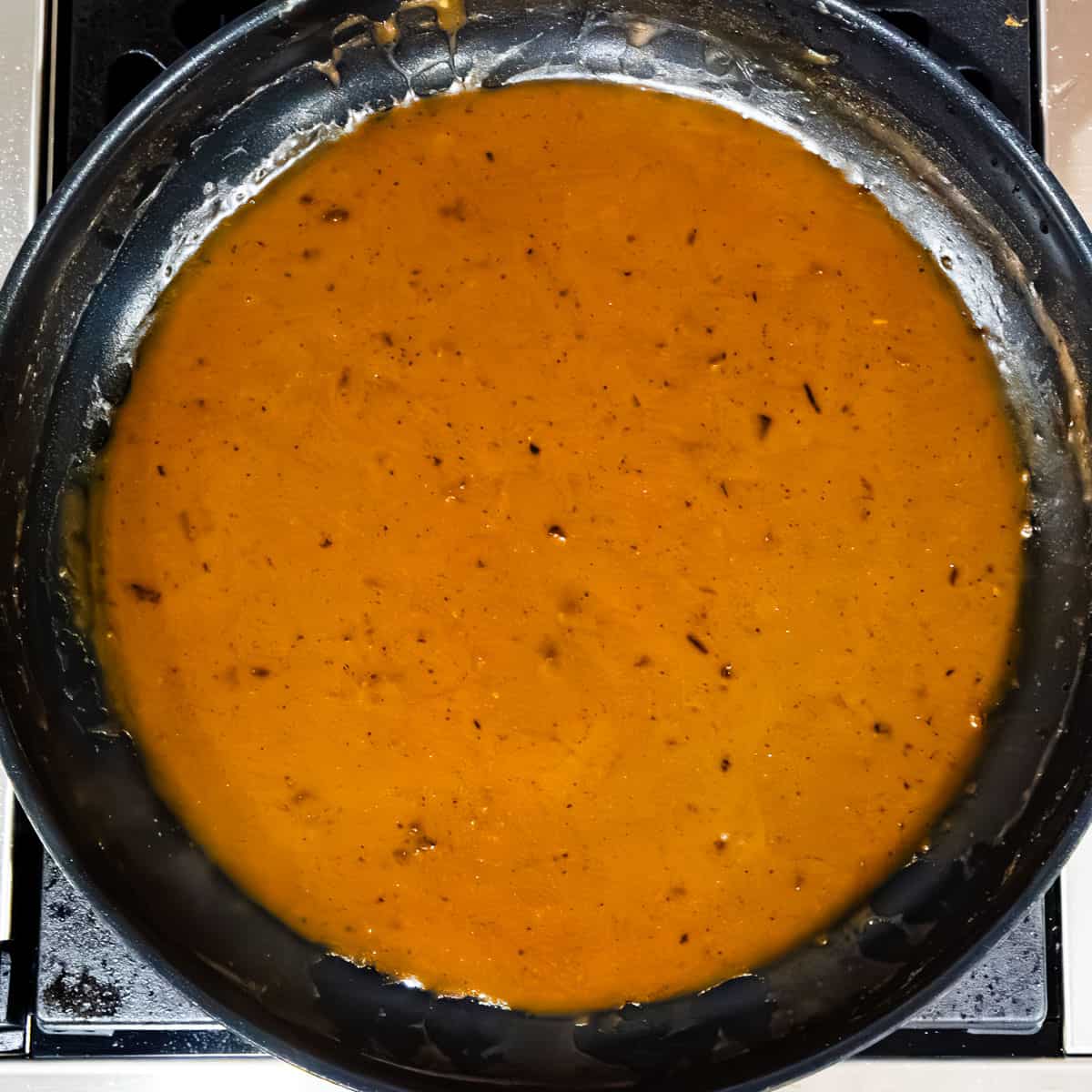 Cajun gravy sauce in a large skillet. 