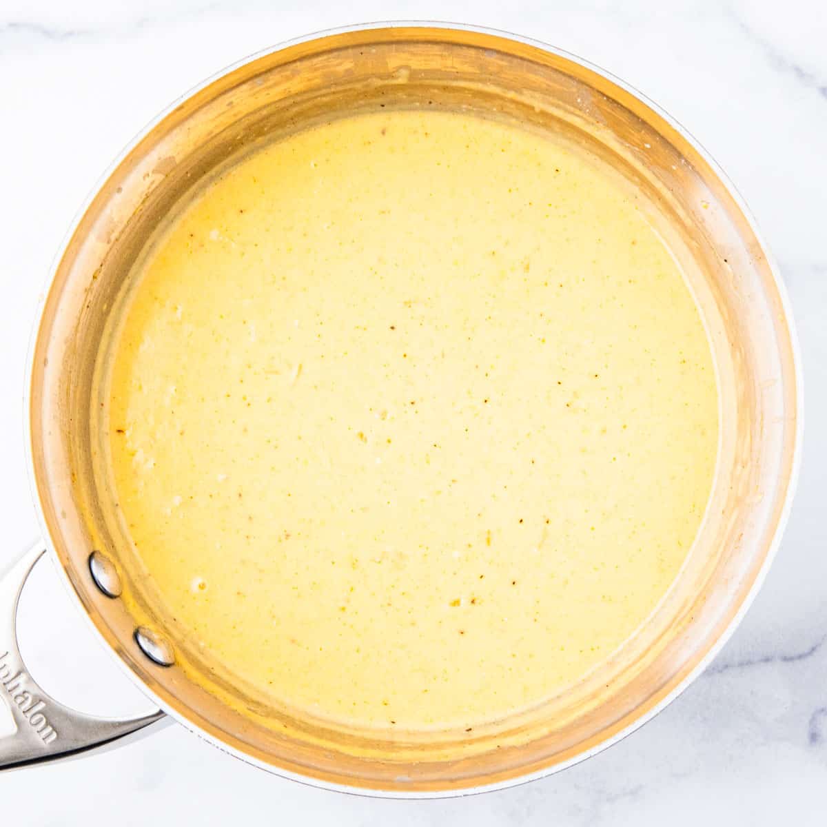 Cream of chicken sauce in a pot. 