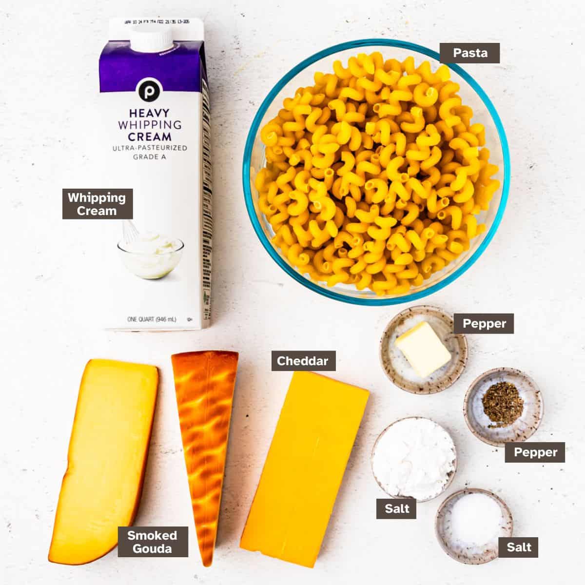 Ingredients for smoked gouda macaroni and cheese arranged on a countertop. 