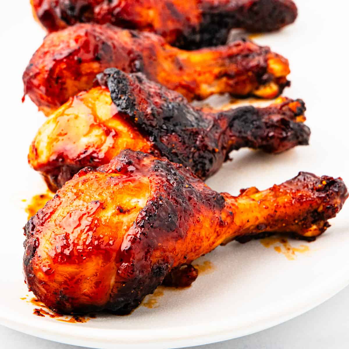 A platter of barbecue chicken legs.