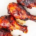 BBQ chicken legs on a platter.