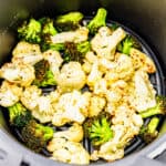 Roasted broccoli and cauliflower in an air fryer.