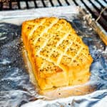 Smoked cream cheese on a small pan in a smoker.