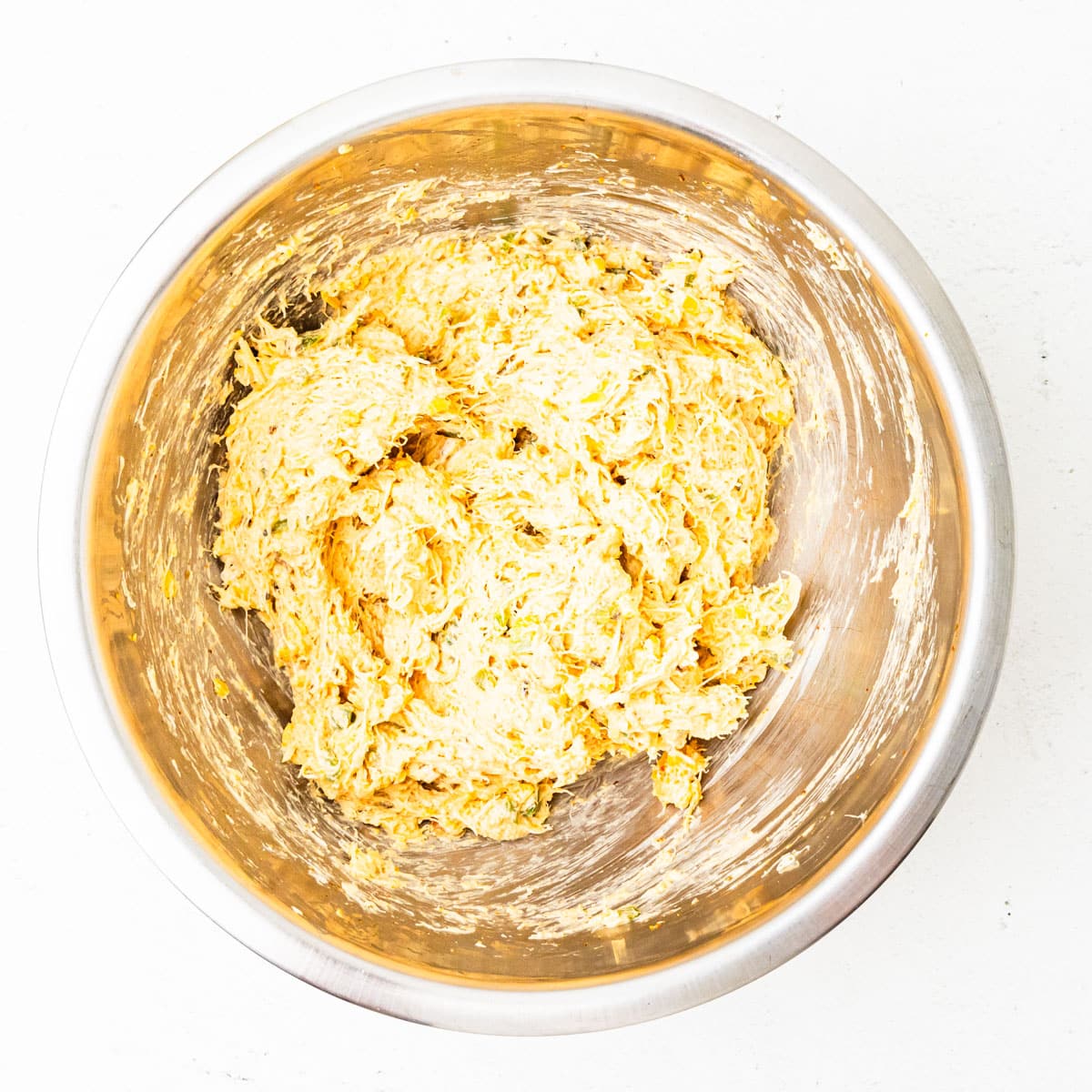 Crab dip mixture in a mixing bowl.