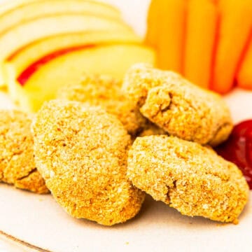 Homemade chicken nuggets on a plate.