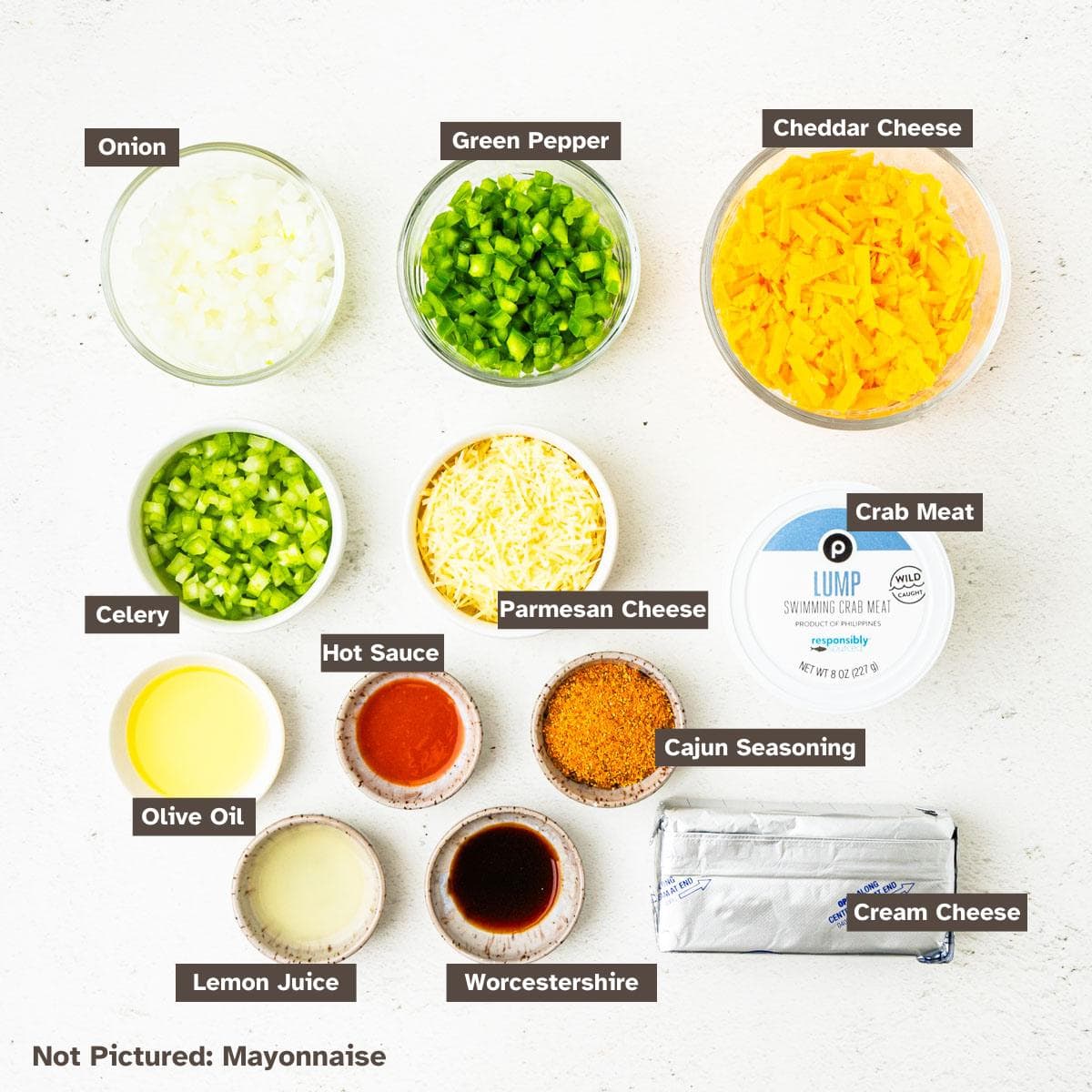 Ingredients for Cajun crab dip arranged on a countertop.