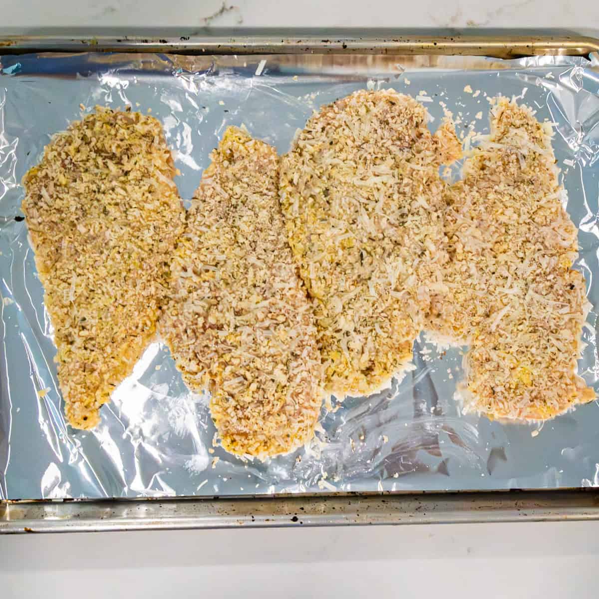 Chicken cutlets breaded with breadcrumbs and Parmesan cheese.