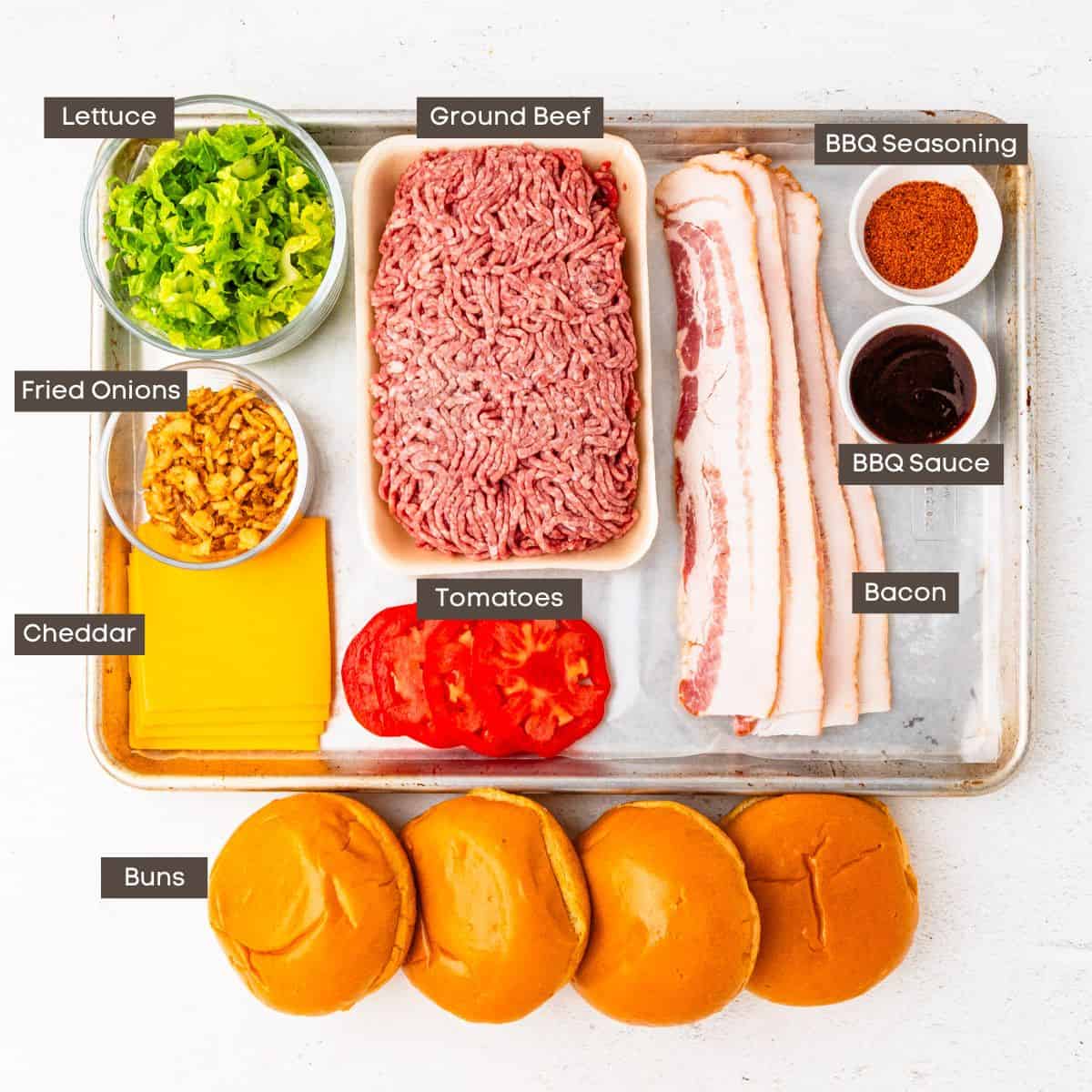 Ingredients for BBQ bacon cheeseburgers arranged on a countertop.