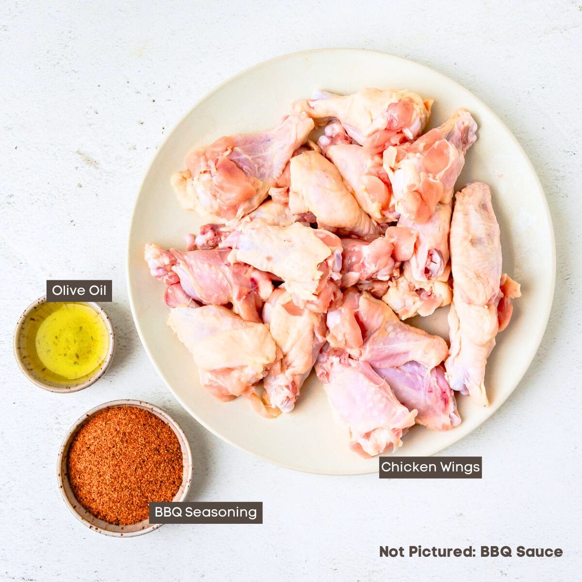 Ingredients for air-fried BBQ chicken wings on a countertop.