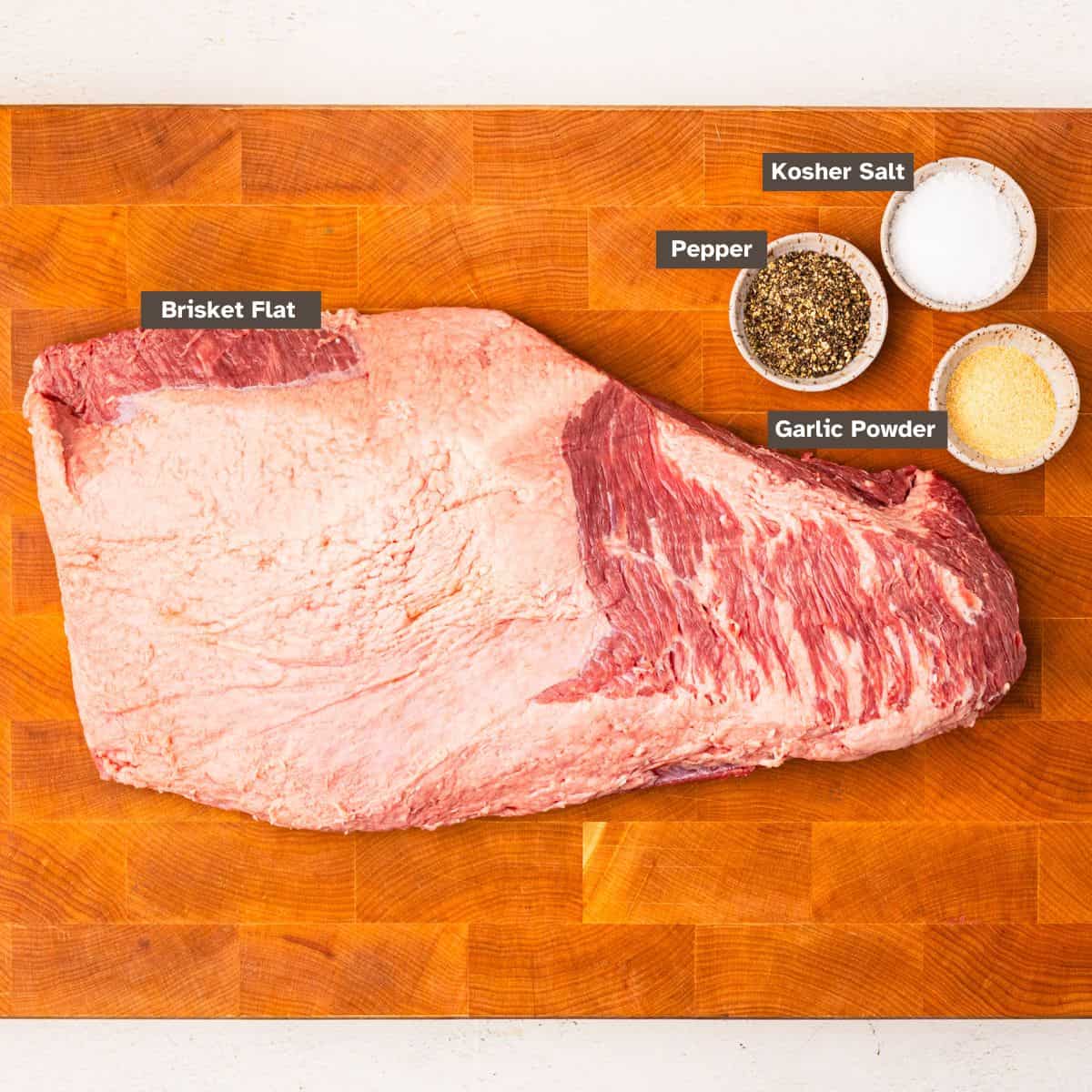 Ingredients for smoked brisket arranged on a countertop.